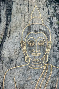 Buddha on the stone wall.