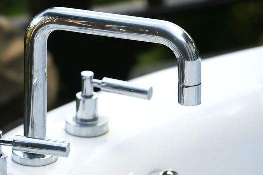 a modern faucet on sink