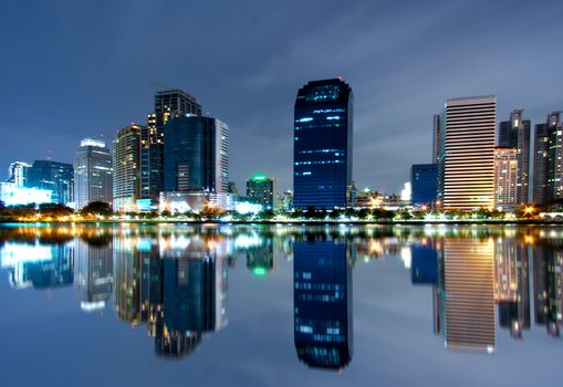 Bangkok city downtown at night with reflection of skyline, Bangkok,Thailand