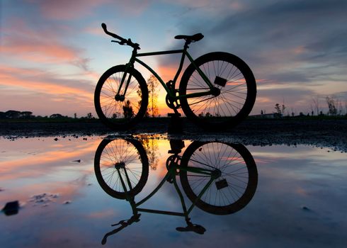 silhouette of a bicycle at sunset