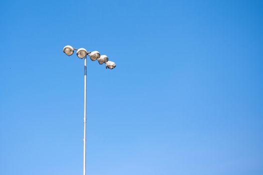 Spot light tower in blue sky