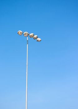 Spot light tower in blue sky