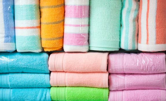 Colorful cotton towels  on shelf