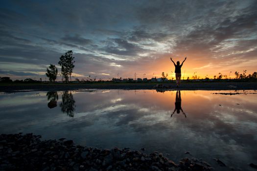 silhouette women and reflection sunset