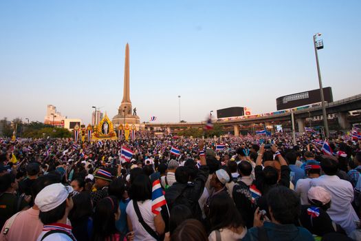 BANGKOK-DEC 22:Unidentified people at Victory monument to expel Yingluck and ask to reform before election on December 22, 2013 in Bangkok, Thailand. About 6 million Thai protesters gather today.