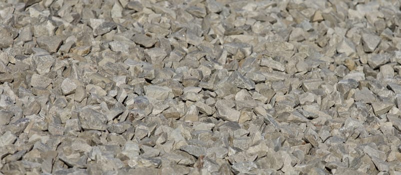 Pattern of the gray rocks on a sunny day