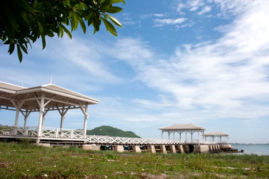 white wooden bridge in waterfront pavilion at the sea