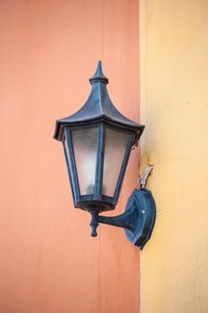 old italian lamp on colour wall