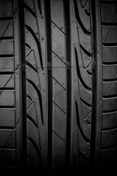 Winter tires close-up on black background