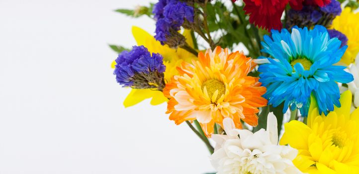 Colorful flower bouquet arrangement in vase isolated on white background