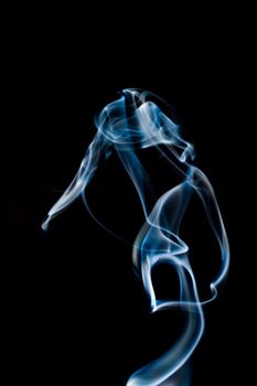 Blur of Abstract blue smoke isolated on black