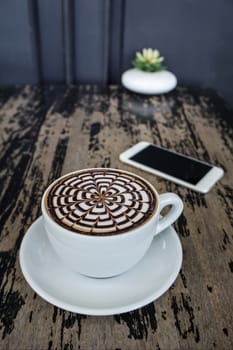 A cups of mocha coffee on wood table