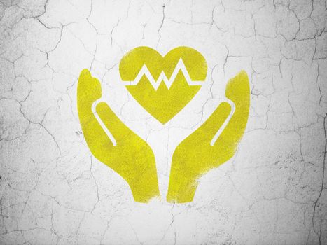 Insurance concept: Yellow Heart And Palm on textured concrete wall background