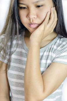 young woman is having strong headache or toothache