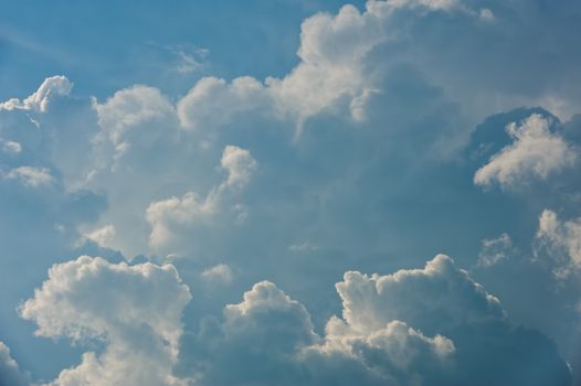 Large fluffy cloud relief details on blue sky