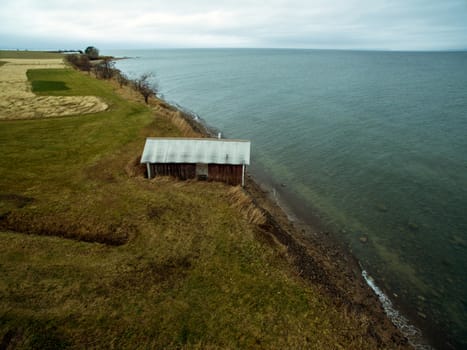 Small hut by the water