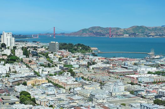 Houses in San francisco with Golden Gate bridge in back