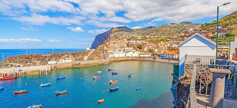 Camara de Lobos, Madeira - June 8, 2013: Panorama of Port / bay with fishing boats. The village is typical for its cat shark drying under the sun.