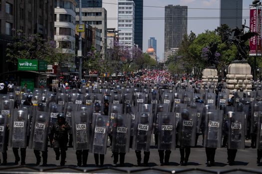 MEXICO, Mexico City: Mexican riot police face hundreds of protesters who march through Mexico City on April 11, 2016 — the day following revolutionary Emiliano Zapata's death anniversary — to draw attention to desires of several indigenous communities. Campesinos, people who live in the rural areas- from all Mexican states, came to the capital to express their discontent with the government. The demonstration was also held to commemorate the famous revolutionary Emilio Zapata.