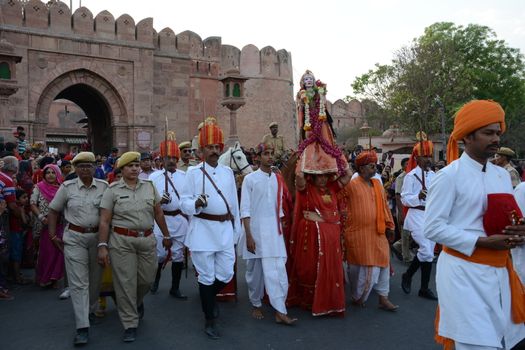 INDIA, Bikaner: Devotees take part in the traditional procession during the Gangaur festival at the Junagarh fort  in Bikaner on April 10, 2016.During the Gangaur festival, married women worship the Hindu goddess Gauri, consort of the deity Shiva. 