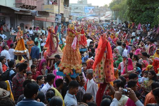 INDIA, Bikaner: Devotees take part in the traditional procession during the Gangaur festival at the Junagarh fort  in Bikaner on April 10, 2016.During the Gangaur festival, married women worship the Hindu goddess Gauri, consort of the deity Shiva. 