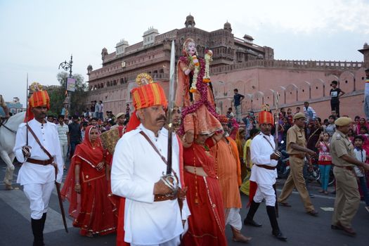 INDIA, Bikaner: Devotees take part in the traditional procession during the Gangaur festival at the Junagarh fort  in Bikaner on April 10, 2016.During the Gangaur festival, married women worship the Hindu goddess Gauri, consort of the deity Shiva. 