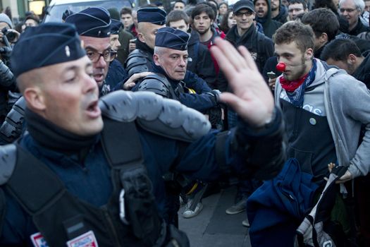 FRANCE, Paris: Protesters clash with riot police during a rally held on the Place de La Republique in Paris as part of demonstrations by the Nuit Debout (Up All Night) movement, on April 11, 2016. French Prime Minister Manuel Valls unveiled measures to help young people find work, aiming to quell weeks of protests against the government's proposed reforms to labour laws. Young people have been at the forefront of mass demonstrations against the reforms over the past month, which the government argues are aimed at making France's rigid labour market more flexible.