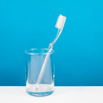 The clear toothbrush with small glass for brushing the teeth.