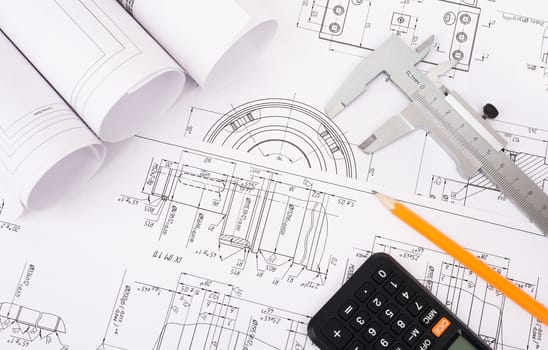 Architecture plan and rolls of blueprints with pencil and calculator. Building concept