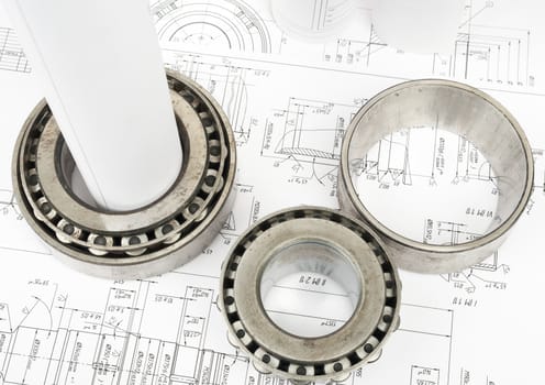 Architecture plan and rolls of blueprints with metal rings, top view. Building concept