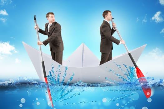 Two businessmen in paper boat rowing in different ways in blue sea, business concept