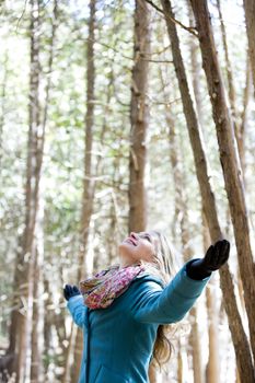 blond casual woman happy outdoors in the woods