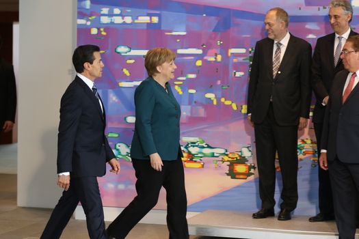 GERMANY, Berlin: Chancellor Angela Merkel and Mexican President Enrique Peña Nieto, walk out for a photo op at the Federal Chancellery on April 12, 2016, in Berlin.The leaders discussed economic relations between Germany and Mexico and held a joint press conference.