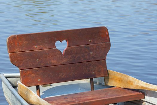 Row boat with heart on a lake
