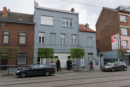 BELGIUM, Brussels: Belgian police are pictured outside a house searched in Uccle, a Brussels' municipality, on April 12, 2016. Three people have been arrested during this new raid linked to the investigation into the November Paris attacks, federal prosecutors said.