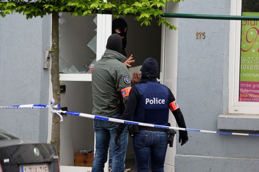BELGIUM, Brussels: Belgian police search a house located in Uccle, a Brussels' municipality, on April 12, 2016. Three people have been arrested during this new raid linked to the investigation into the November Paris attacks, federal prosecutors said.