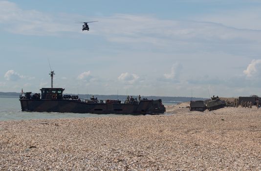 UNITED KINGDOM, Gosport, Hampshire: Troops gathering on shore as part of Griffin Strike exercise on April 12, 2016.British and French troops came ashore in a dramatic display that attracted the attention those on the beach. The exercise is a culmination of years of naval cooperation between the two nations, and is intended to test the partnership and readiness between the countries.