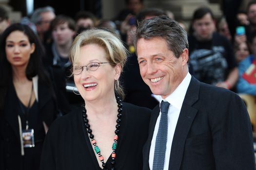 ENGLAND, London: Meryl Streep and Hugh Grant attend the Florence Foster Jenkins premiere, on April 12, 2016, at the Odeon Leicester Square.The film stars Meryl Streep, who plays Florence Foster Jenkins, Hugh Grant, and Simon Helberg. It is based on the real life story of an heiress who wanted to become an opera singer,despite having a horrible voice. 