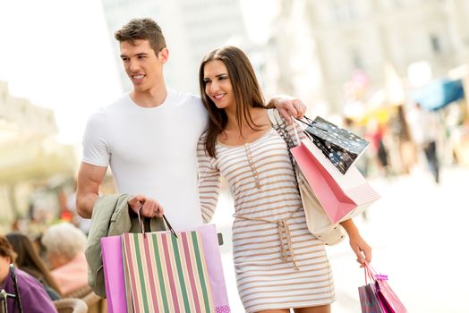 Beautiful couple enjoying shopping together.