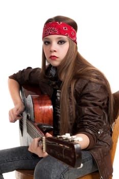 the girl the teenager in a leather jacket with a guitar on a white background