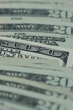 100 dollars close up between 20 dollars bills