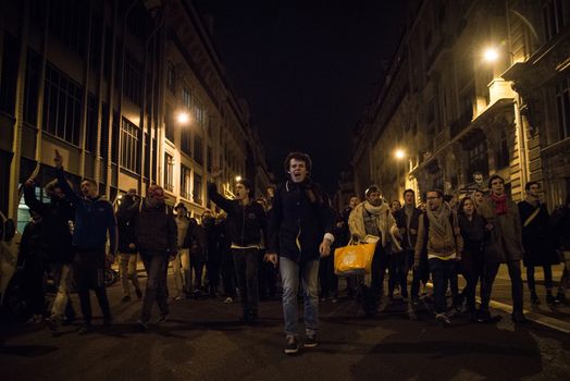 FRANCE, Paris: Hundreds of protesters rally in front of a police station in the 2nd arrondissement of Paris during a night demonstration, on April 12, 2016, to claim the release of a student arrested earlier in the day. 