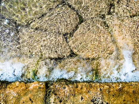 Background formed by the water of a stream flowing over rocks.