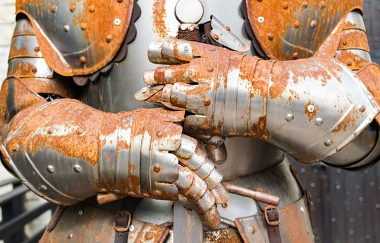 Detail of an old rusty medieval armor.