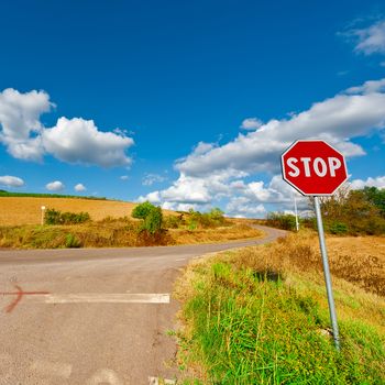 Road Stop Sign before the Intersection in Tuscany, Italy