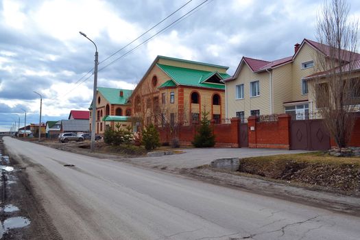 Unfinished cottages in the cottage settlement. Tyumen, Russia