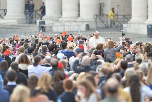 VATICAN, Rome: A large crowd cheers as Pope Francis rides by for his weekly general audience in St. Peter's Square, at the Vatican on April 13, 2016.The Pope's message was that Jesus is a good doctor, and there is no sickness he cannot cure. He went on to mention how Jesus got sinners, including St. Matthew, to follow him and be disciples. 