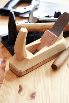 Set of carpenter tools on wooden workbench