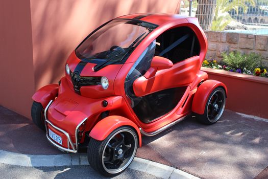 Monte-Carlo, Monaco - April 11, 2016: Red and Black Electric Car Renault Twizy (Tuning) Parked in a Parking Lot of Monte-Carlo Beach Club in Monaco