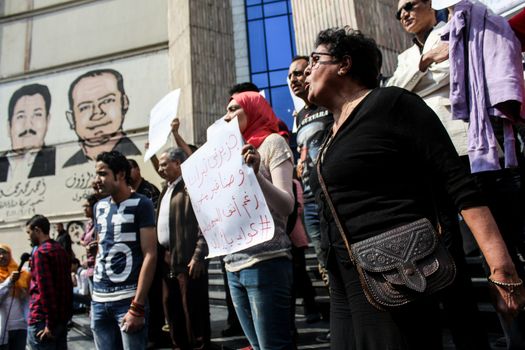 EGYPT, Cairo: Protesters hold banners against Egypt's decision to cede sovereignty over two Red Sea islands, Sanafir and Tiran, to Saudi Arabia on April 13, 2016 in Cairo, before the syndicate of journalists building. Online, many Egyptians have accused their once-popular President, Abdel-Fattah el-Sissi, of giving up land to curry favor with the Saudis. On Twitter, the hashtag I feel like selling what to Saudi Arabia trended on April 12, 2016 with commentators suggesting Egypt flog everything from self-serving lawmakers to President Abdel-Fattah el-Sissi himself.